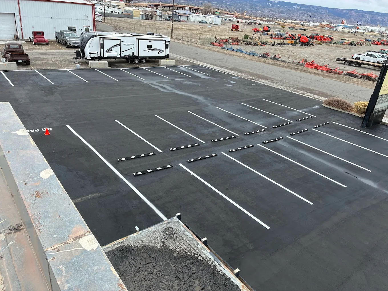 Striped commercial parking lot paved by D&M Paving